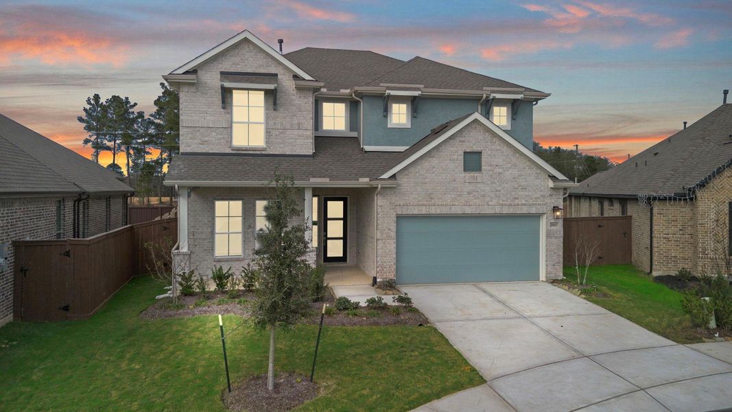Front exterior of a new home in The Trails, New Caney, TX, highlighting curb appeal (Image 22).