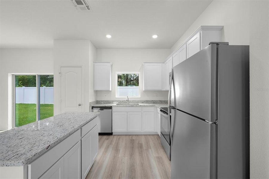 Furnished interior view inside a new home in Tula Parc, Astatula (Image 7).