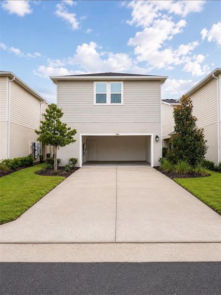 Front exterior of a new home in , St. Cloud, FL, highlighting curb appeal (Image 21).