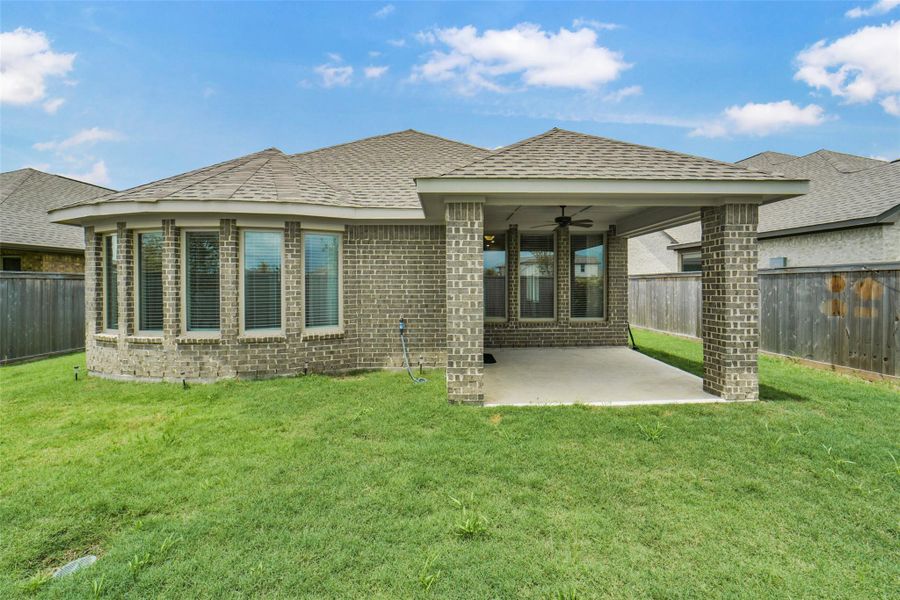 Exterior details and patio area of a home in Bridgeland, Cypress (Image 25).