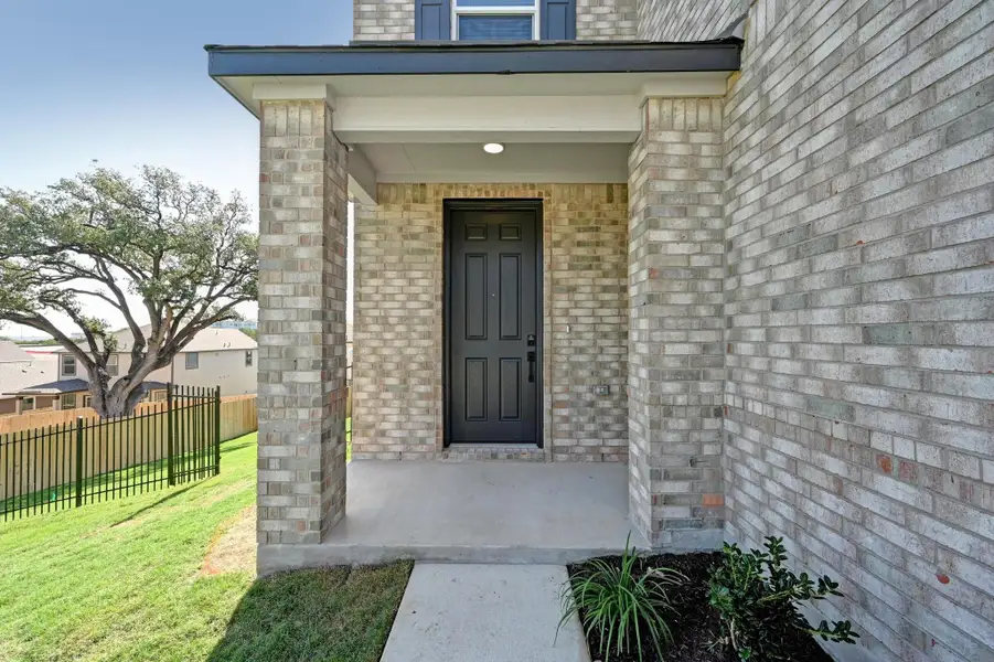 Exterior details and patio area of a home in Creekside at Estancia, Austin (Image 3). Exterior details and patio area of a home in Creekside at Estancia, Austin (Image 3).