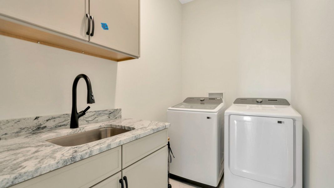 The Laundry Room of a DRB Homes Grand Eider model, which is a home plan offered at Serengeti in Spring Hill, FL.