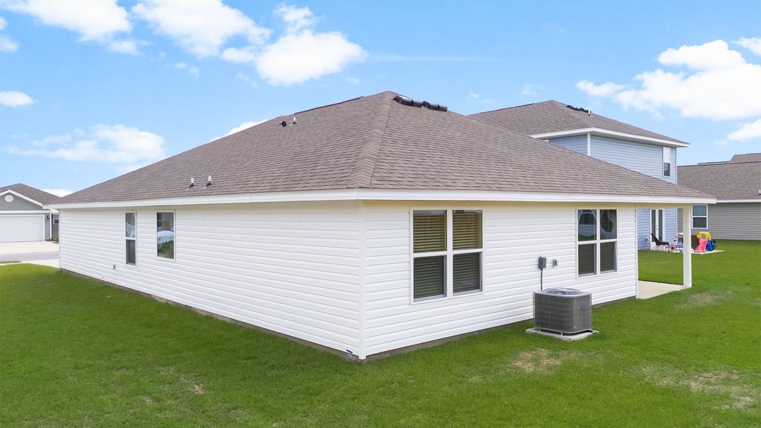 Front exterior of a new home in Titus Park, Panama City, FL, highlighting curb appeal (Image 15). Front exterior of a new home in Titus Park, Panama City, FL, highlighting curb appeal (Image 15).