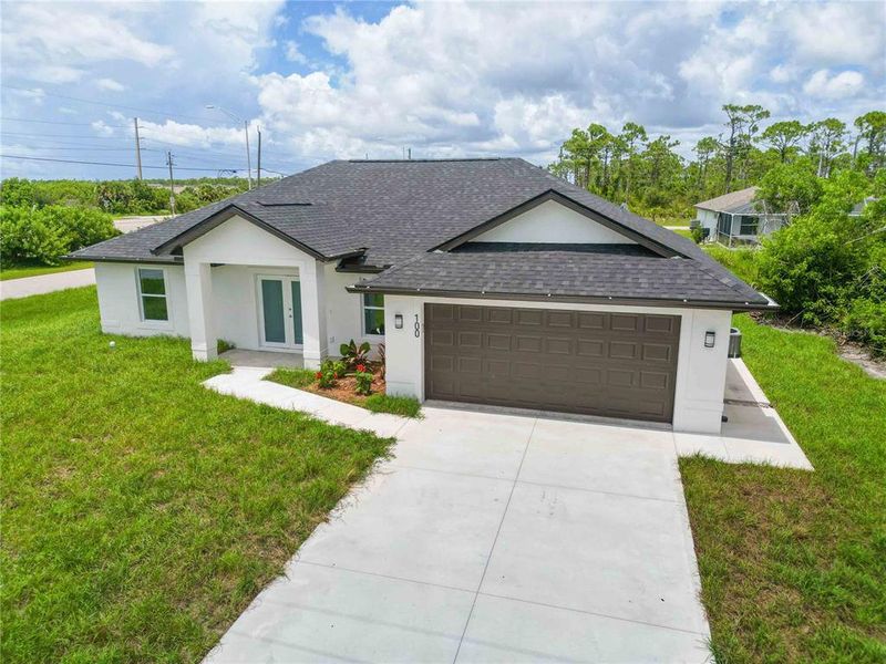 Front exterior of a new home in , Rotonda West, FL, highlighting curb appeal (Image 18).