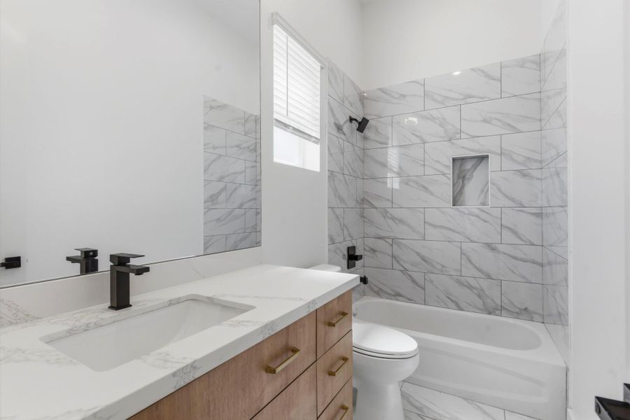 Private bathroom attached to the first-floor bedroom, providing comfort and functionality for guests or extended stays.