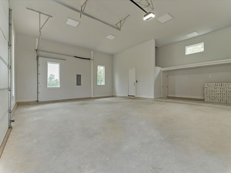 Expansive Casita garage offering clean lines, tall ceilings, abundant lighting, and versatile open space—perfect for vehicles, storage, or a future workshop in a beautifully finished setting.