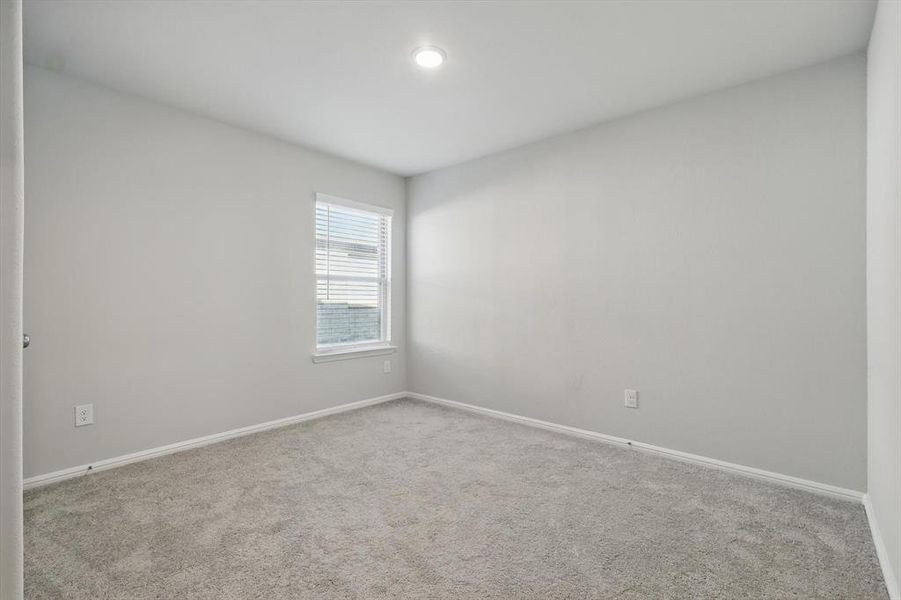 Unfurnished room featuring carpet flooring and baseboards Unfurnished room featuring carpet flooring and baseboards