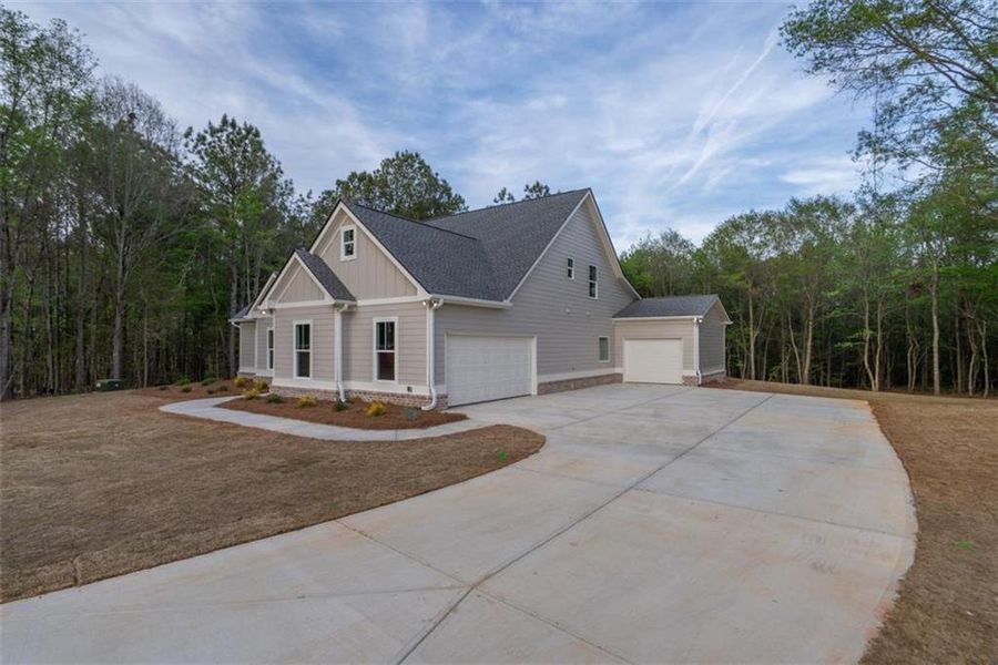 Front exterior of a new home in , Social Circle, GA, highlighting curb appeal (Image 24).
