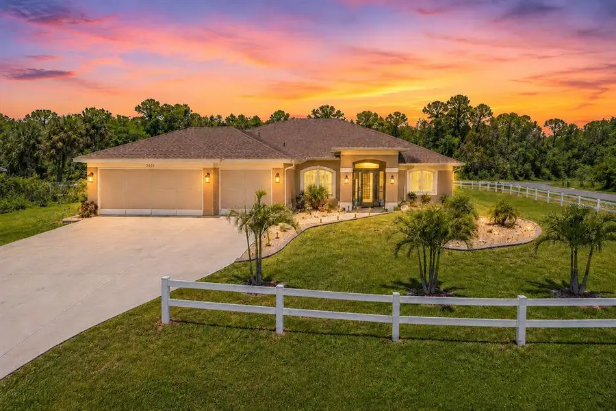 Front exterior of a new home in , North Port, FL, highlighting curb appeal (Image 1). Front exterior of a new home in , North Port, FL, highlighting curb appeal (Image 1).