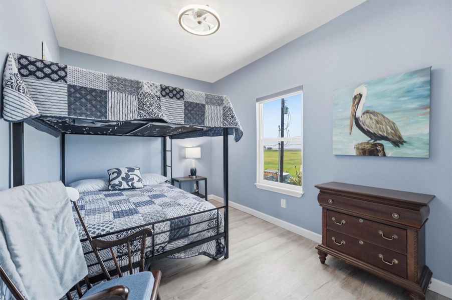 Bright and cozy bedroom featuring a stylish bunk beds Bright and cozy bedroom featuring a stylish bunk beds