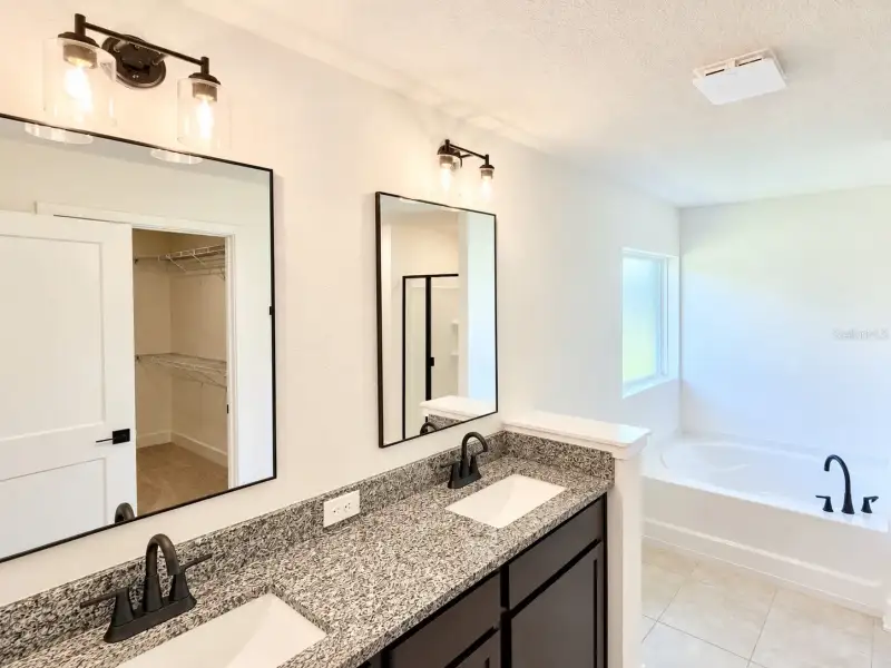 Furnished interior view inside a new home in Harmony Central, Harmony (Image 7).