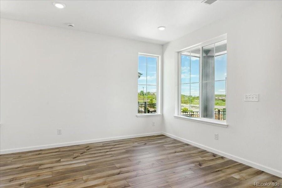 Spacious, unfurnished interior of a new home in Pacific Collection at The Townes at Skyline Ridge, Castle Pines (Image 12).