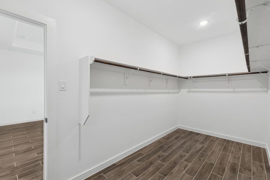 Walk-in closet in the primary suite Walk-in closet in the primary suite