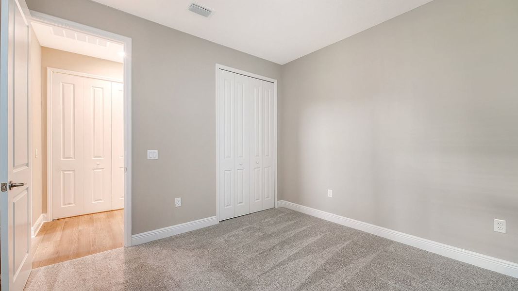 Spacious, unfurnished interior of a new home in Wildleaf Real Estate and Homes for Sale in Parrish, FL - Neal Communities, Parrish (Image 27).