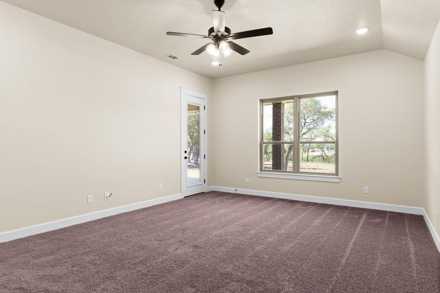 Spare room with dark carpet, recessed lighting, lofted ceiling, and a ceiling fan Spare room with dark carpet, recessed lighting, lofted ceiling, and a ceiling fan