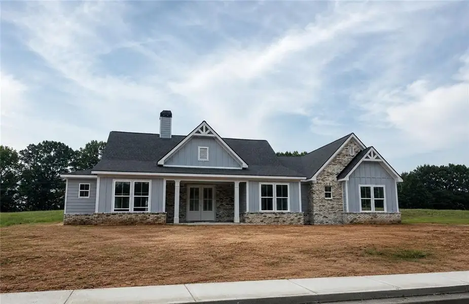 Front exterior of a new home in , Statham, GA, highlighting curb appeal (Image 1). Front exterior of a new home in , Statham, GA, highlighting curb appeal (Image 1).