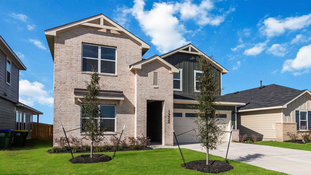 Front exterior of a new home in Monarch Ranch, Manor, TX, highlighting curb appeal (Image 4).