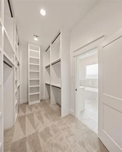 Walk in closet with light carpet Walk in closet with light carpet