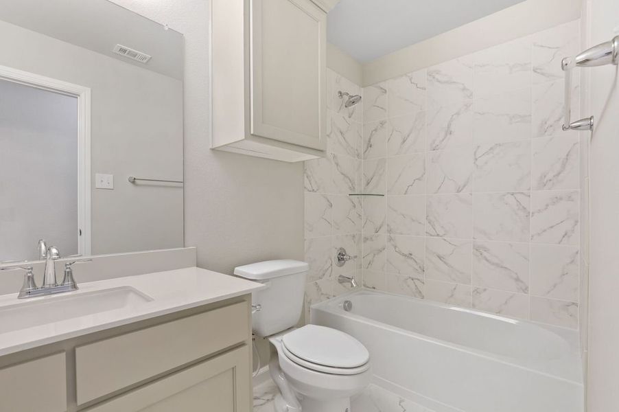 Bathroom in the Pulitzer home plan by Trophy Signature Homes – REPRESENTATIVE PHOTO