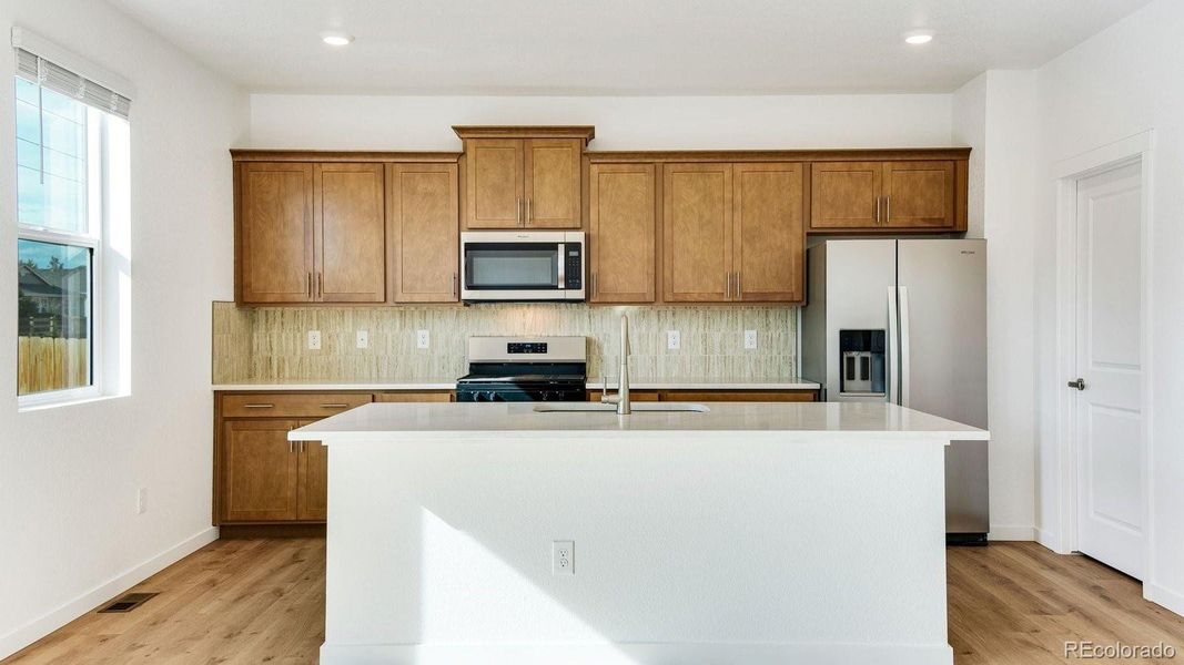 Furnished interior view inside a new home in Trails at Crowfoot, Parker (Image 6).