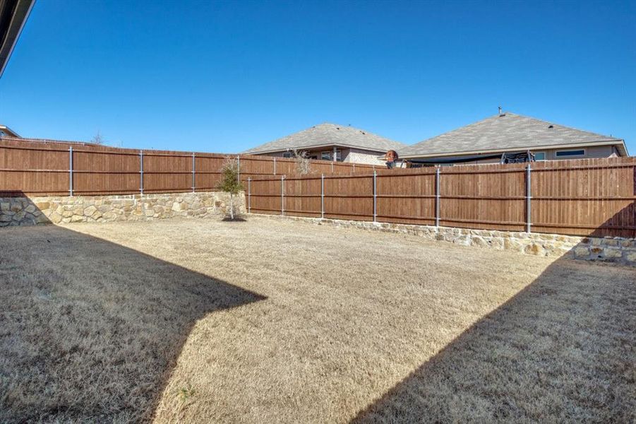 View of yard featuring a fenced backyard