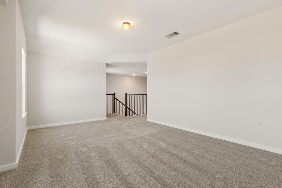 Spacious, unfurnished interior of a new home in Sunterra, Katy (Image 17).