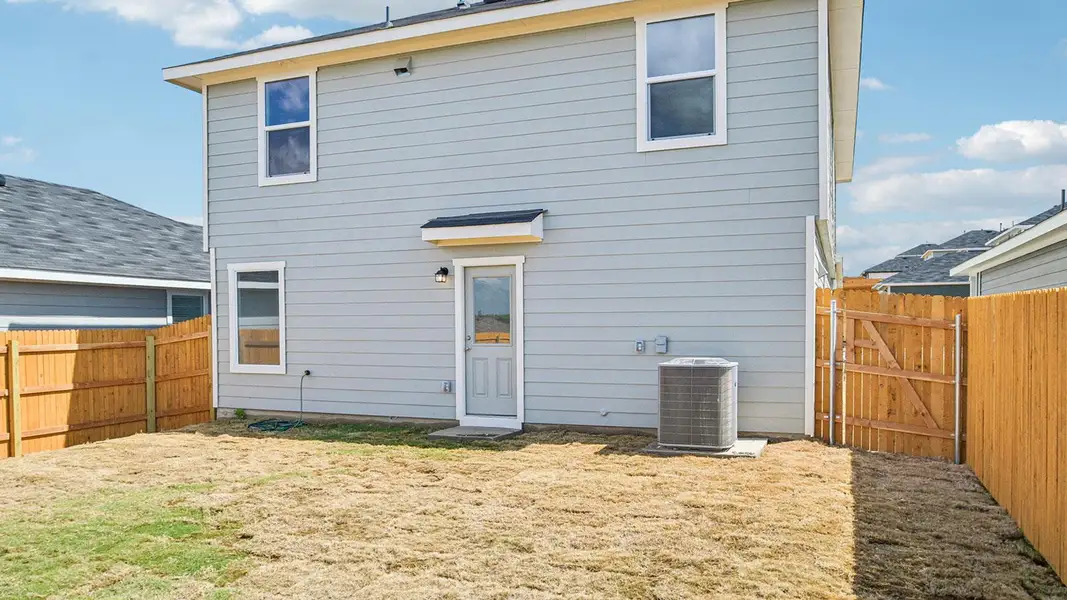 Exterior details and patio area of a home in Prairie Lakes, Buda (Image 4).