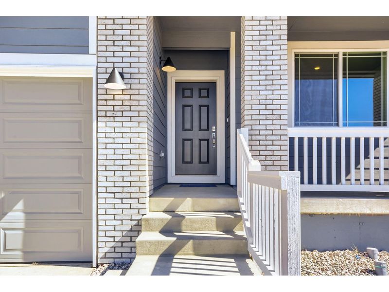 Exterior details and patio area of a home in Farmstead, Berthoud (Image 25).