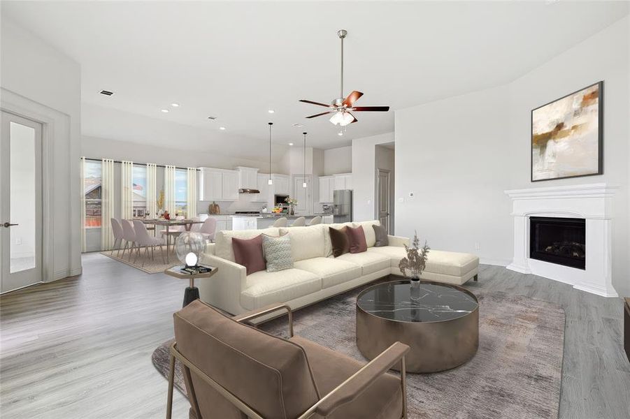 Living room featuring light wood-type flooring and ceiling fan