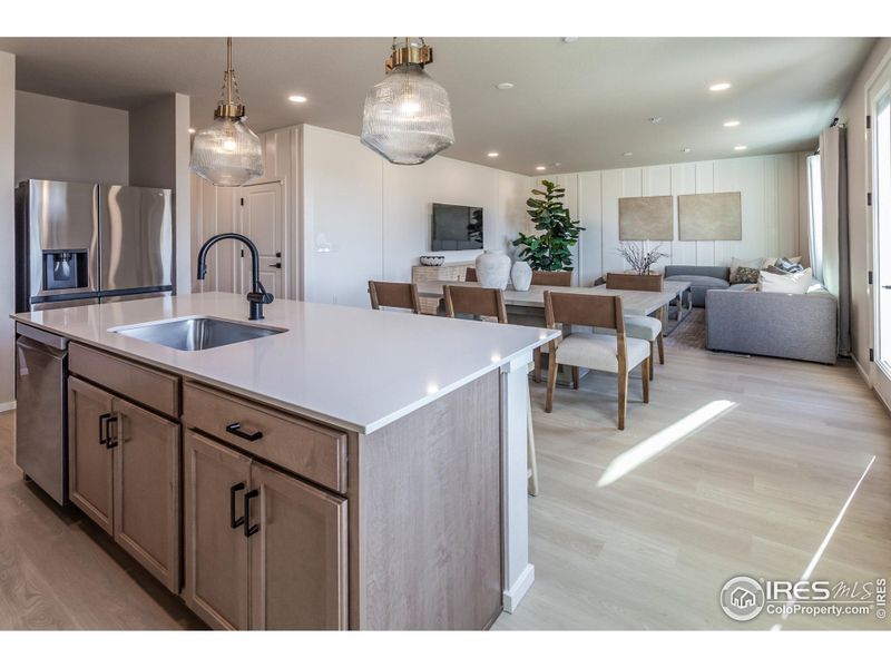 EXAMPLE PHOTO: KITCHEN OPEN TO DINING AND LIVING ROOM