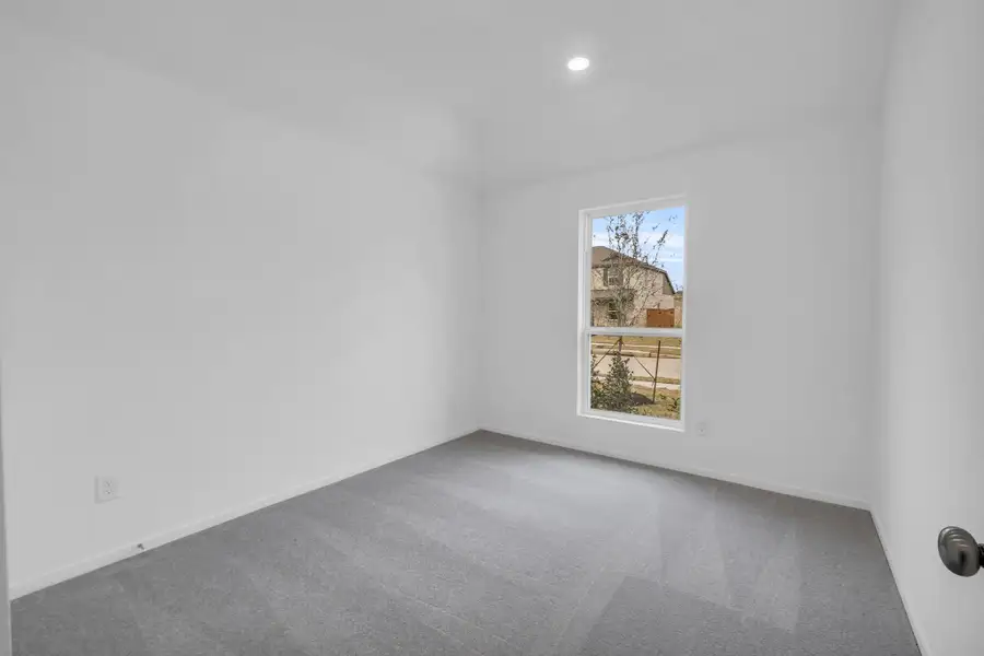 Spacious, unfurnished interior of a new home in Windrose Green: Bristol Collection, Angleton (Image 18).