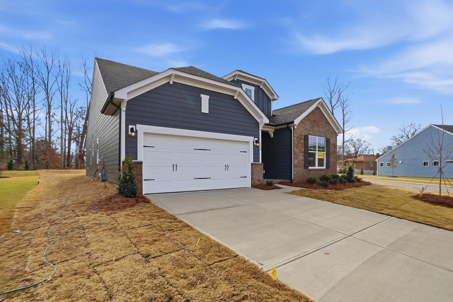 Front exterior of a new home in Villas at Prestwick, Mooresville, NC, highlighting curb appeal (Image 25). Front exterior of a new home in Villas at Prestwick, Mooresville, NC, highlighting curb appeal (Image 25).
