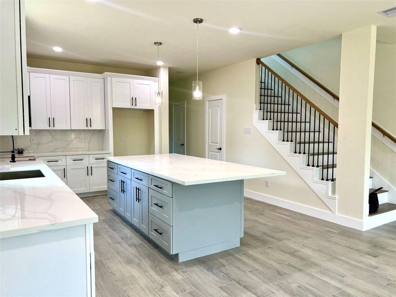 Spacious island with abundant cabinet storage. Spacious island with abundant cabinet storage.