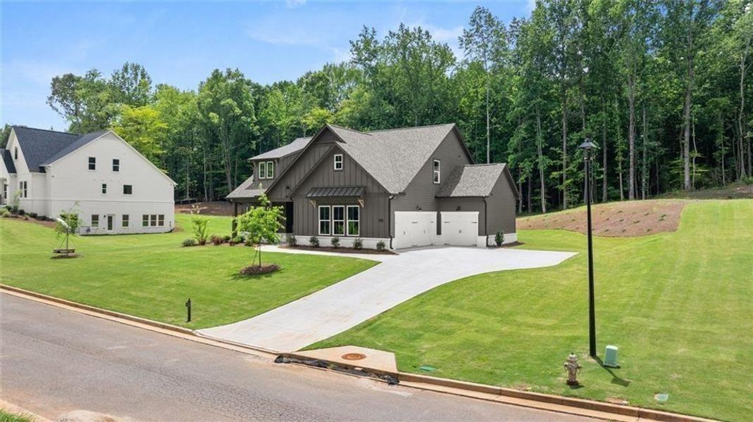 Front exterior of a new home in , Gainesville, GA, highlighting curb appeal (Image 20).