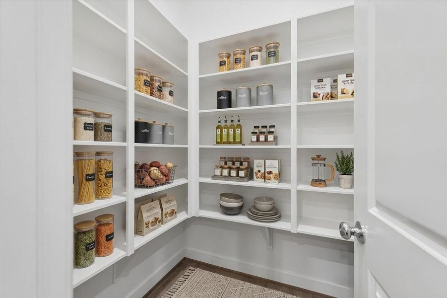 walk in pantry with built ins for maximum convenience - Photo is of model at 6340, finishes are similar. walk in pantry with built ins for maximum convenience - Photo is of model at 6340, finishes are similar.