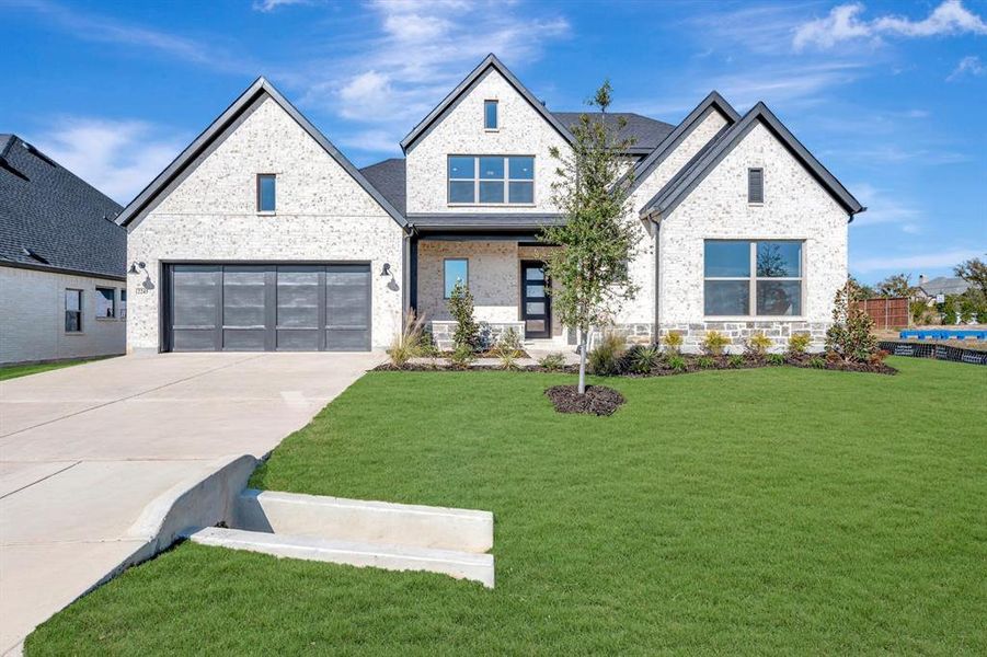 Front exterior of a new home in Northshore at Lakewood Village - Garden Series, Lakewood Village, TX, highlighting curb appeal (Image 1). Front exterior of a new home in Northshore at Lakewood Village - Garden Series, Lakewood Village, TX, highlighting curb appeal (Image 1).