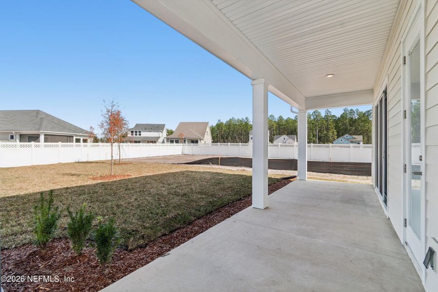 Exterior details and patio area of a home in Evergreen Island at Silverleaf - Executive, St. Augustine (Image 3).