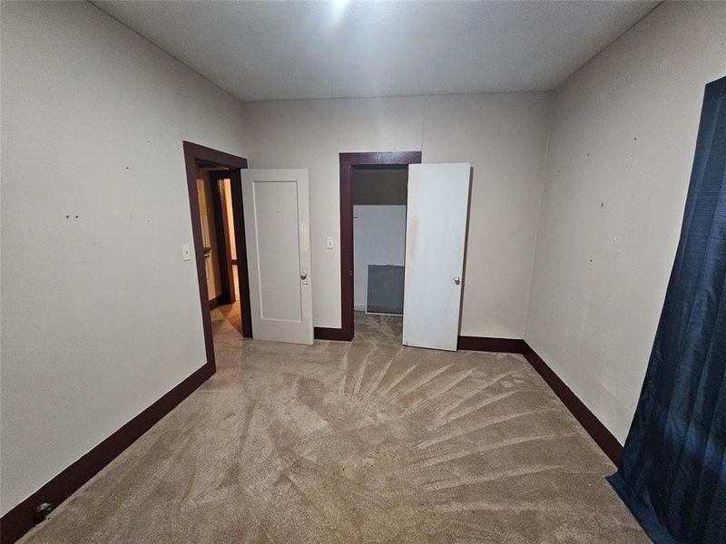 Unfurnished bedroom with light carpet Unfurnished bedroom with light carpet