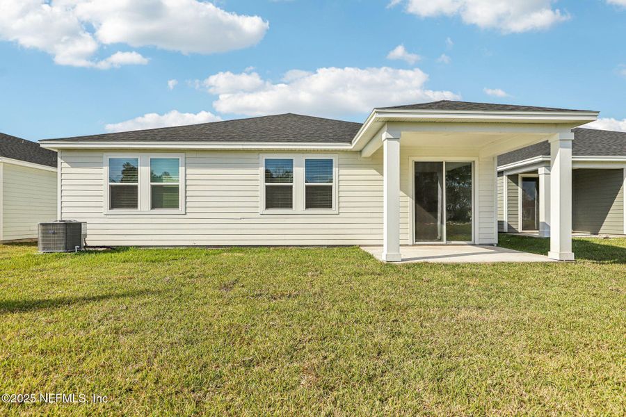 Exterior details and patio area of a home in Cypress Meadows - Signature Series, Jacksonville (Image 4).