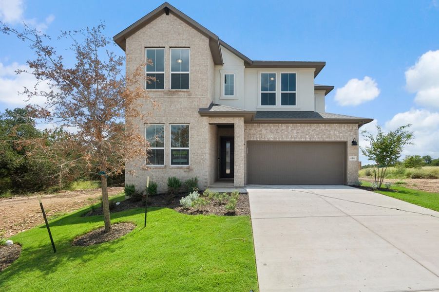 Front exterior of a new home in Arbor Collection At Wolf Ranch, Georgetown, TX, highlighting curb appeal (Image 1).