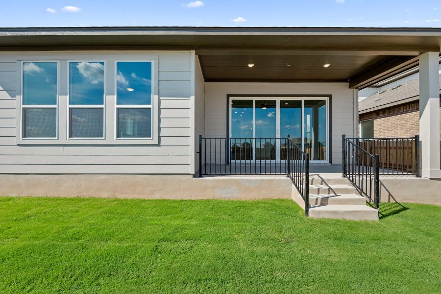 Exterior details and patio area of a home in Lariat, Liberty Hill (Image 26).