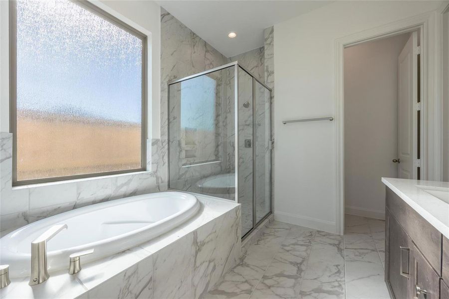 Primary bath with separate bathtub and shower