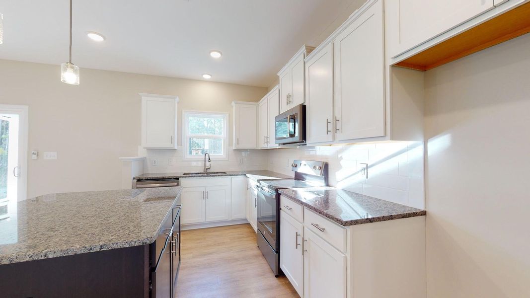Representative furnished interior of a home built from the Jacob A by JC Jackson Homes,LLC in Heritage Pointe, Newport (Image 7).