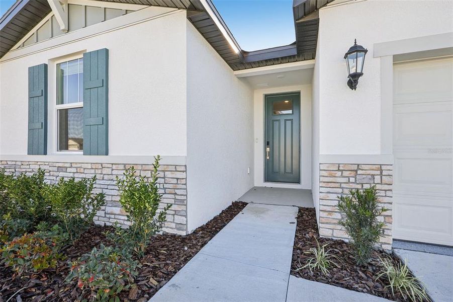 Exterior details and patio area of a home in The Grove at Stuart Crossing - Classic Series, Bartow (Image 3).