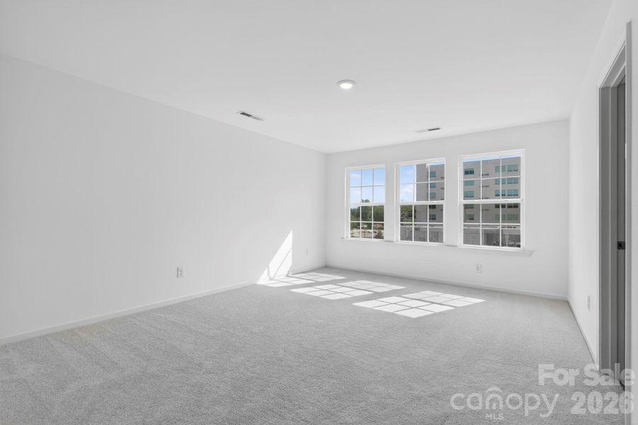 Owners bedroom with tons of windows