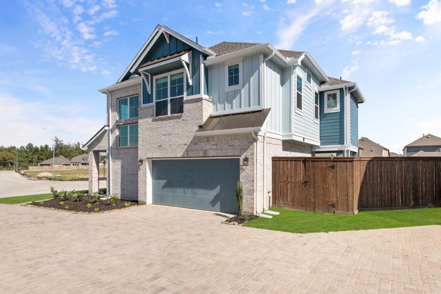 Front exterior of a new home in Sienna, Missouri City, TX, highlighting curb appeal (Image 22).