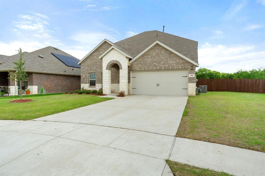 Front exterior of a new home in Stonehaven, Caddo Mills, TX, highlighting curb appeal (Image 20).