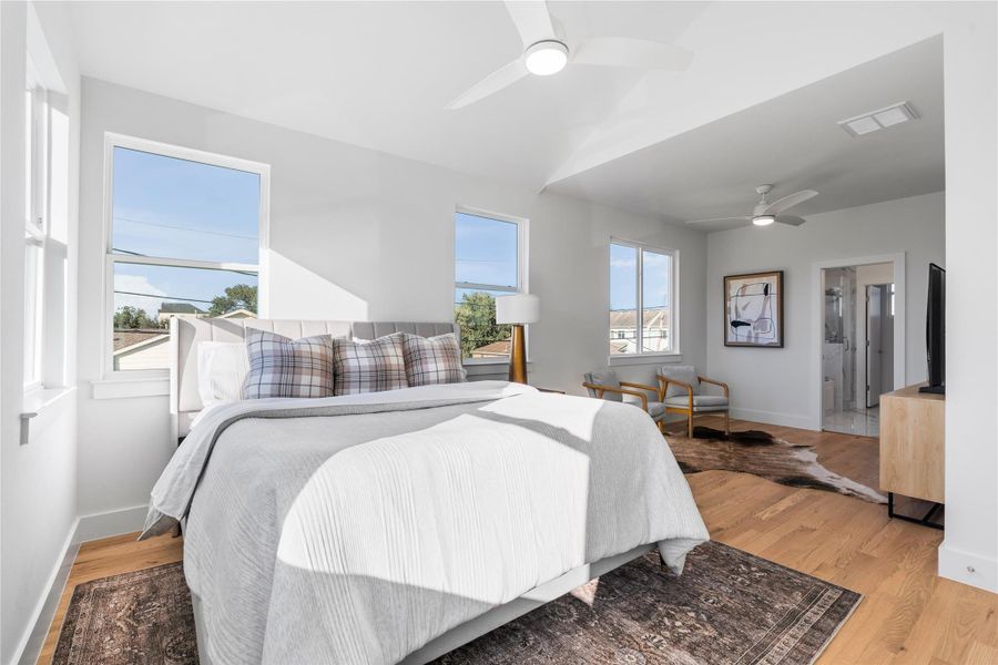 Expansive primary suite with cathedral ceilings, abundant natural light & enough space for a cozy sitting area, creating the perfect retreat at the end of the day. Expansive primary suite with cathedral ceilings, abundant natural light & enough space for a cozy sitting area, creating the perfect retreat at the end of the day.