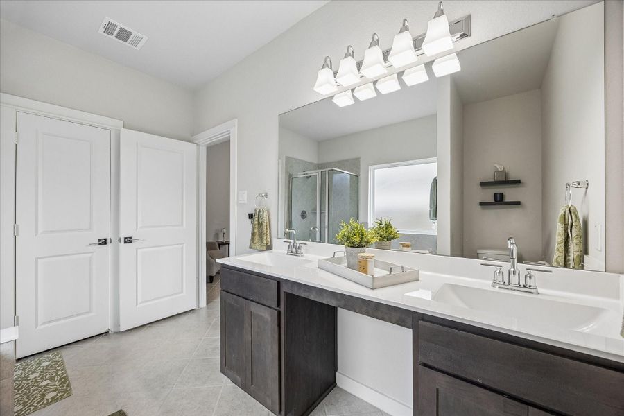 Large en-suite with tons of light and dual vanities. Large en-suite with tons of light and dual vanities.