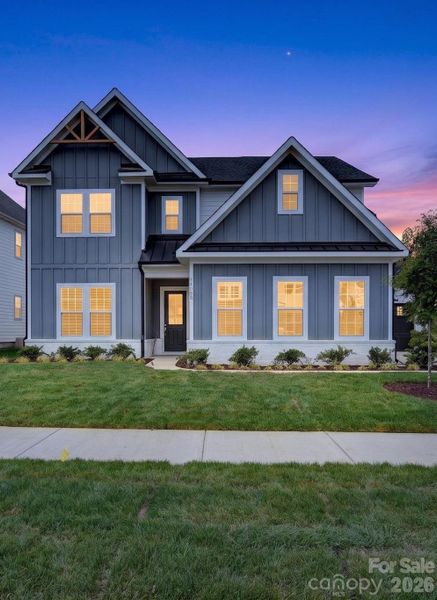 Front exterior of a new home in Coventry Glen, Huntersville, NC, highlighting curb appeal (Image 27). Front exterior of a new home in Coventry Glen, Huntersville, NC, highlighting curb appeal (Image 27).